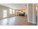 Spacious living room flows into kitchen with large island and abundant natural light from large windows at 1730 Fulmont Cir, Mableton, GA 30126