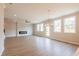 This living room offers wood floors, plenty of windows, a modern fireplace, and lots of natural light at 1730 Fulmont Cir, Mableton, GA 30126