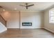 This living room boasts wood floors, a modern fireplace, and easy access to the staircase at 1730 Fulmont Cir, Mableton, GA 30126
