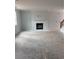 A well-lit living room with a white-painted brick fireplace as the focal point at 1730 Fulmont Cir, Mableton, GA 30126