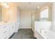 Modern primary bathroom with tub, shower, and dual vanities at 1730 Fulmont Cir, Mableton, GA 30126