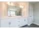 Elegant bathroom boasts double sinks, stone counters, and modern fixtures at 1730 Fulmont Cir, Mableton, GA 30126