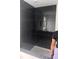 The shower features black vertical tiling with a built-in wall niche and chrome shower head at 1730 Fulmont Cir, Mableton, GA 30126