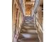Unfinished stairway featuring wooden support beams and new construction, offering a glimpse of the floors above at 1730 Fulmont Cir, Mableton, GA 30126