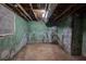 Unfinished basement with painted walls and exposed ceiling at 246 Stafford Nw St, Atlanta, GA 30314