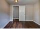 The bedroom features wood floors, neutral paint, and a closet at 246 Stafford Nw St, Atlanta, GA 30314