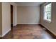 Bedroom features hardwood floors, a closet, a window, and neutral paint at 246 Stafford Nw St, Atlanta, GA 30314