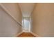 View of a carpeted staircase with neutral walls and trim at 246 Stafford Nw St, Atlanta, GA 30314