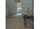 Empty attic space with neutral carpet, light blue walls, and a small window at 4 Kelso At Peyton Sw Dr, Atlanta, GA 30311