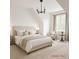 Bright, virtually staged bedroom features neutral tones, a plush bed, and natural light at 4 Kelso At Peyton Sw Dr, Atlanta, GA 30311