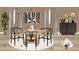 Cozy dining room featuring a round table, stylish black chairs, and elegant decor at 4 Kelso At Peyton Sw Dr, Atlanta, GA 30311