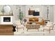 Comfortable living room with a fireplace, plush seating, and stylish decorative elements at 4 Kelso At Peyton Sw Dr, Atlanta, GA 30311