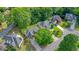 Aerial view of a suburban neighborhood with mature trees and well-maintained homes at 510 Morning Mist Ct, Alpharetta, GA 30022