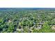 Expansive aerial view of a peaceful neighborhood surrounded by mature trees and manicured lawns at 510 Morning Mist Ct, Alpharetta, GA 30022