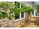 Exterior showcasing backyard vines on trellis and cozy outdoor sitting at 510 Morning Mist Ct, Alpharetta, GA 30022