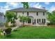 Spacious backyard featuring a patio, firepit, lush lawn, and well-maintained landscaping at 510 Morning Mist Ct, Alpharetta, GA 30022