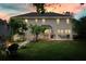Spacious backyard featuring a patio, firepit, lush lawn, and well-maintained landscaping at 510 Morning Mist Ct, Alpharetta, GA 30022