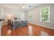 Cozy bedroom featuring hardwood floors and a ceiling fan at 510 Morning Mist Ct, Alpharetta, GA 30022