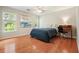Bedroom featuring hardwood floors, a ceiling fan and a desk area at 510 Morning Mist Ct, Alpharetta, GA 30022