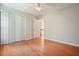 Spacious bedroom with hardwood floors, a ceiling fan, and double door closet at 510 Morning Mist Ct, Alpharetta, GA 30022