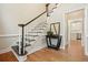 Foyer featuring hardwood floors, staircase, and a view into the kitchen, providing an inviting welcome at 510 Morning Mist Ct, Alpharetta, GA 30022