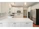 Modern kitchen features white cabinets, granite countertops, and stainless steel appliances at 510 Morning Mist Ct, Alpharetta, GA 30022