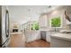 Open kitchen with stainless steel appliances, granite countertops, and a view into the living area at 510 Morning Mist Ct, Alpharetta, GA 30022