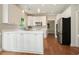 Well-lit kitchen with white cabinets, stainless steel appliances, and hardwood flooring at 510 Morning Mist Ct, Alpharetta, GA 30022