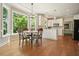 Bright kitchen nook featuring a dining table, a chandelier, and lots of natural light from the windows at 510 Morning Mist Ct, Alpharetta, GA 30022