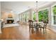 Bright and airy living room with a fireplace, large windows and hardwood floors, perfect for relaxation at 510 Morning Mist Ct, Alpharetta, GA 30022