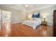 Main bedroom with hardwood floors, tray ceiling and natural light at 510 Morning Mist Ct, Alpharetta, GA 30022
