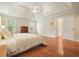 Spacious main bedroom with hardwood floors, tray ceiling and natural light from multiple windows at 510 Morning Mist Ct, Alpharetta, GA 30022