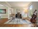 Office space with hardwood floors, natural light, and decorative wall mirror at 510 Morning Mist Ct, Alpharetta, GA 30022