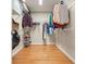 Walk-in closet with hardwood floors and wire shelving at 510 Morning Mist Ct, Alpharetta, GA 30022