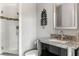 Modern bathroom featuring a glass shower, stainless steel sink and granite countertop at 943 Peachtree Ne St # 1708, Atlanta, GA 30309