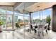 Modern dining room with city views through large glass windows, and designer lighting at 943 Peachtree Ne St # 1708, Atlanta, GA 30309