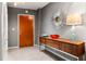 Entryway with console table, statement mirror, and modern lamp at 943 Peachtree Ne St # 1708, Atlanta, GA 30309