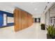 Bright hallway featuring sleek tile floors, wood accents, and recessed lighting for a modern and inviting space at 943 Peachtree Ne St # 1708, Atlanta, GA 30309