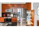 Kitchen with stainless appliances, wood cabinets, and pull-out pantry shelves at 943 Peachtree Ne St # 1708, Atlanta, GA 30309