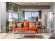 A contemporary living room with a large sofa, stylish decor, and expansive windows at 943 Peachtree Ne St # 1708, Atlanta, GA 30309