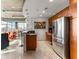 Open-concept living area with kitchen island, stainless appliances, and city views at 943 Peachtree Ne St # 1708, Atlanta, GA 30309