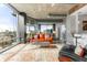 Living room with comfortable seating, city views, and modern lighting fixtures at 943 Peachtree Ne St # 1708, Atlanta, GA 30309