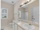 Bathroom featuring a double vanity, white cabinets, and large mirror at 127 Autumn Run Pl, Villa Rica, GA 30180