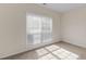 Bedroom featuring natural light from a large window and neutral walls at 127 Autumn Run Pl, Villa Rica, GA 30180