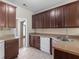 Traditional kitchen features wooden cabinets, neutral countertops, and stainless steel sink at 127 Autumn Run Pl, Villa Rica, GA 30180