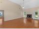 Large living room features hardwood floors, fireplace, soaring ceilings, and natural light from many windows at 127 Autumn Run Pl, Villa Rica, GA 30180