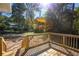 Sun-drenched backyard deck with a railing offers a secluded space to relax and enjoy the outdoors at 1342 Carter Rd, Decatur, GA 30030