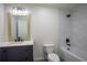 Clean bathroom featuring modern fixtures, tiled walls, a bathtub, and a sleek vanity at 1342 Carter Rd, Decatur, GA 30030