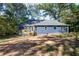 Backyard view of home featuring a back porch and spacious yard at 1342 Carter Rd, Decatur, GA 30030