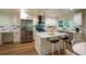 Modern kitchen featuring white cabinets, stainless steel appliances, and a central island with seating, great for cooking at 1342 Carter Rd, Decatur, GA 30030